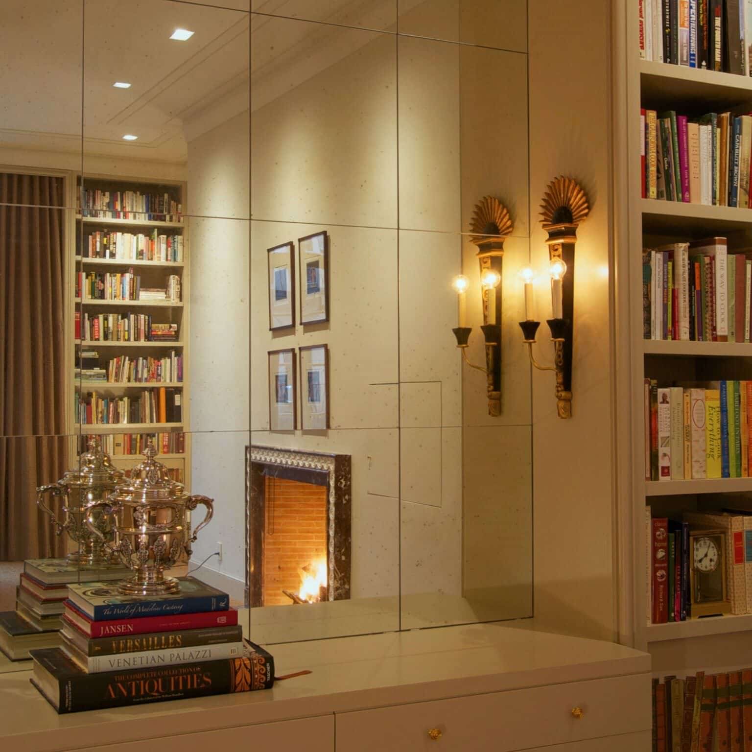 Mirrored wall and sconce in Morgan Studios Apartment | Rodman Paul Architects