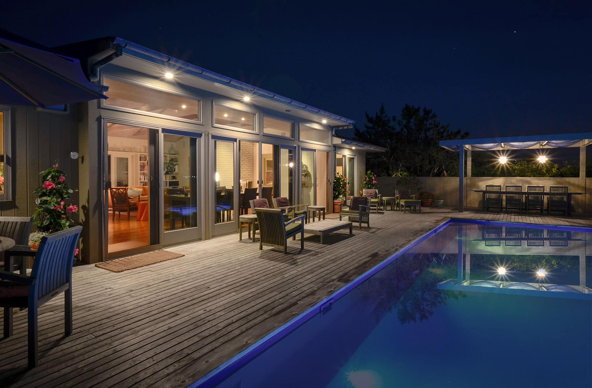 Pool and deck at night, Shore Walk Beach Home, Fire Island Pines | Rodman Paul Architects